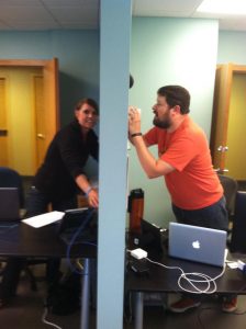 Kevin laments lack of technology at a technology company with Gwen. “When do we get phones Gwen? My Morse Code is shaky.”